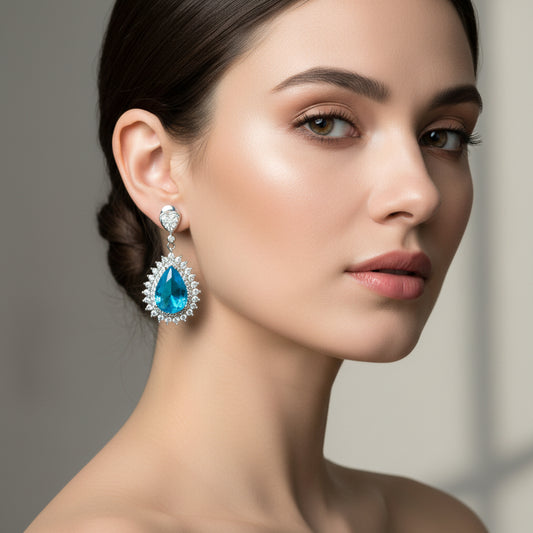 A pair of ocean blue earrings with a geometric pattern and rhodium plating, designed with American diamonds.